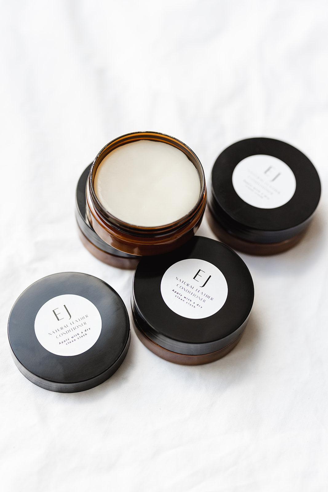 Ella Jackson Natural Leather Conditioner — set of jars with one opened to show smooth balm texture