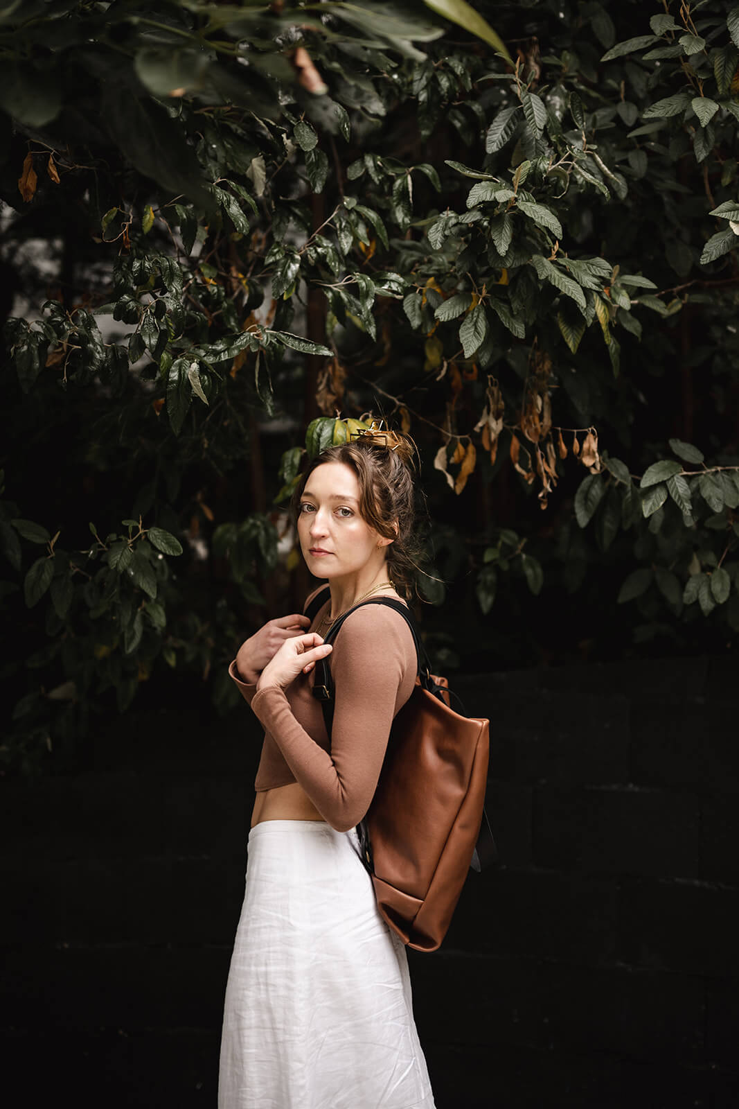 Black backpack with brown straps sale