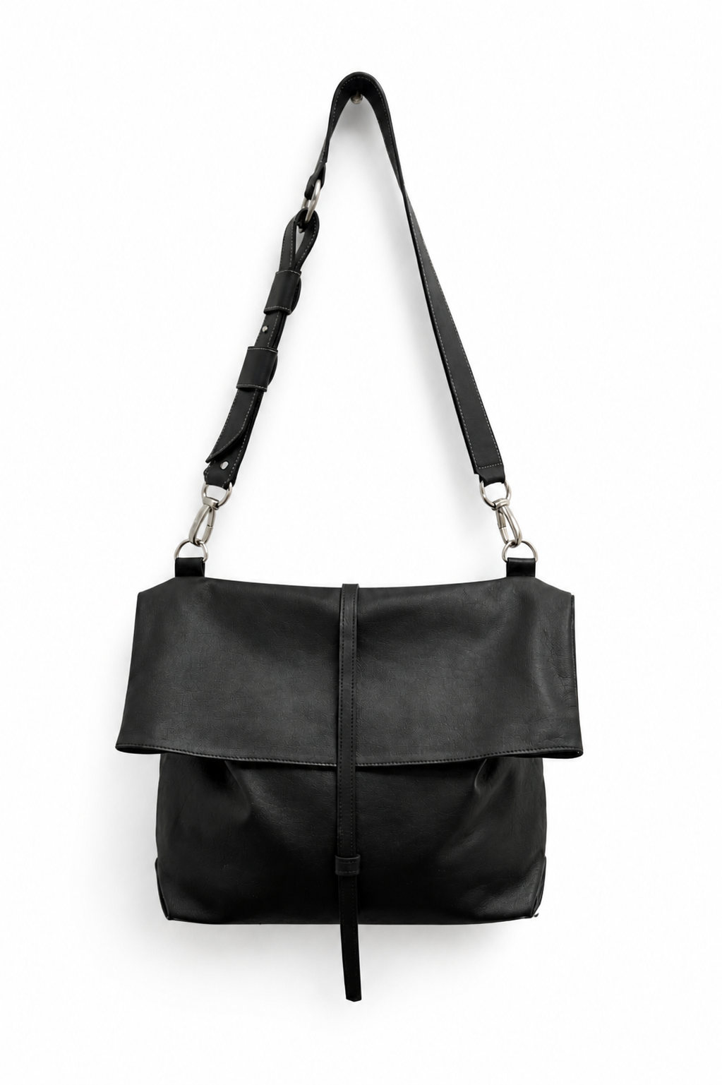 Black leather art bag by Ella Jackson Australia with adjustable shoulder strap and fold-over flap, handcrafted and displayed in STUDIO Ella Jackson, Hobart.